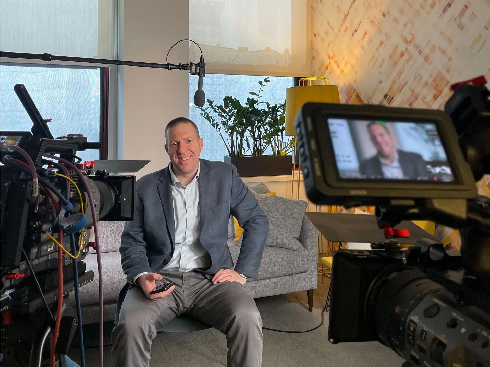 Dan Gorecki seated in a studio during a filmed interview